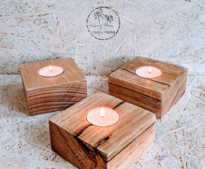 Three of our Tea for One handcrafted Tasmanian oak tealight holders on plaing white Crafty Palms background.